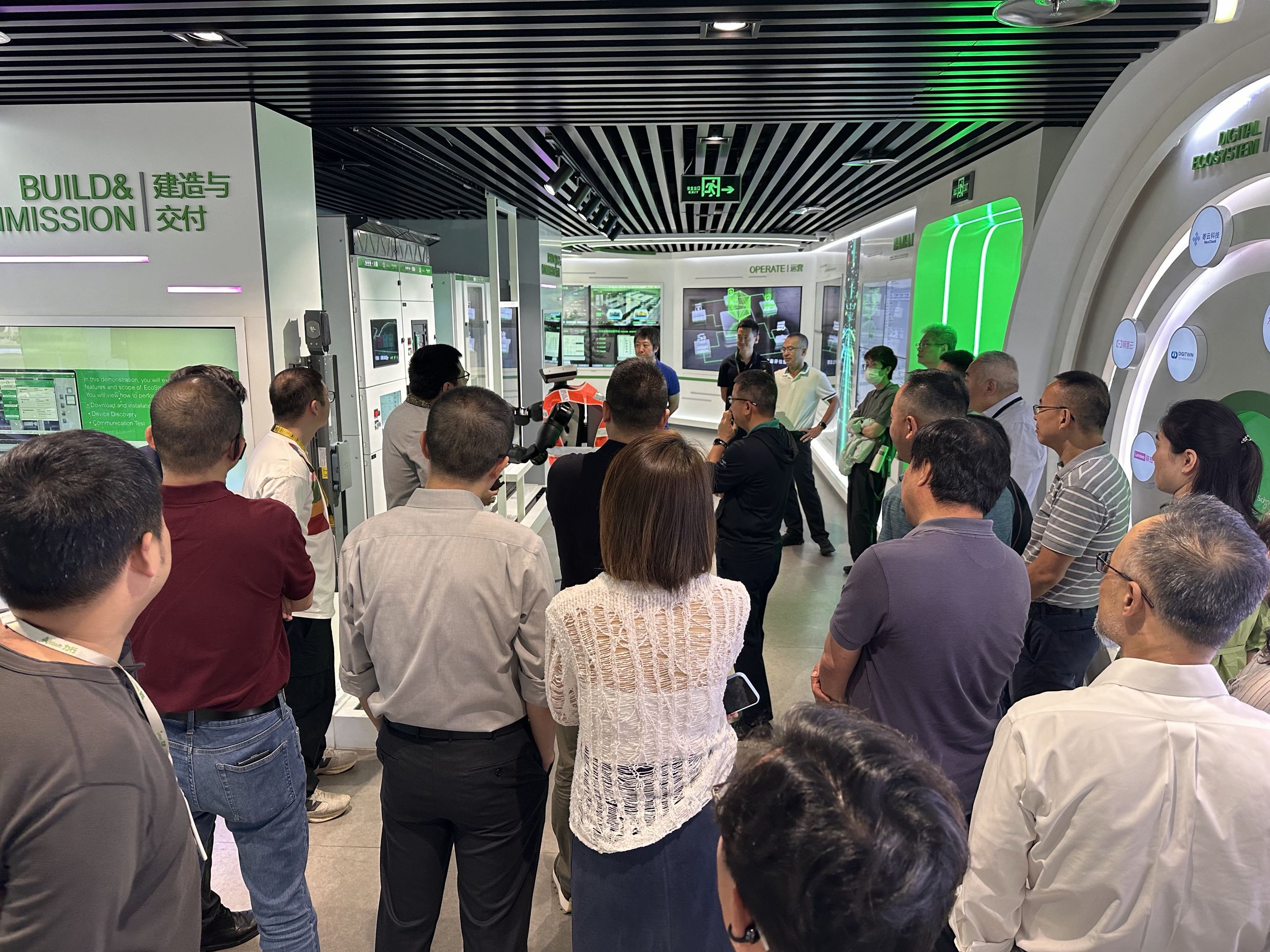 Group watching a live demo of the digital ecosystem and robotic inspection setup